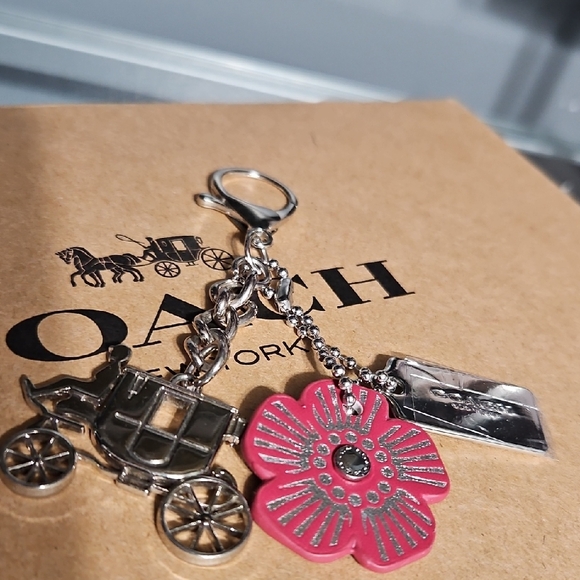 Coach Accessories - COACH EUC CARRIAGE Silver Charm and Pink Floral Leather Tag